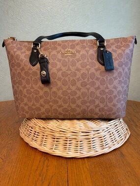 Coach Tan Signature Canvas Tote with Black Leather Trim
Coach Leather Key Fob